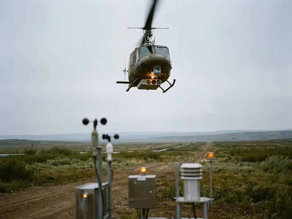 Helicopter with sensor array flying low over rural gas pipeline corridor, atmospheric instruments glowing amber on ground below, overcast sky above open fields.
